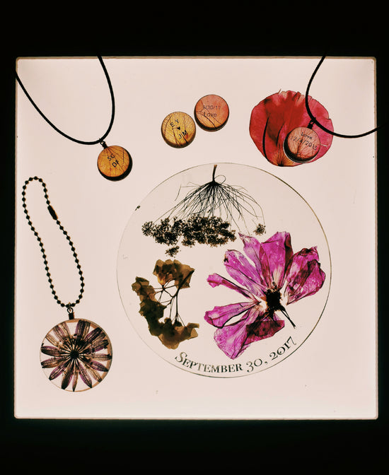 Multiple custom pendants filled with different flower petals