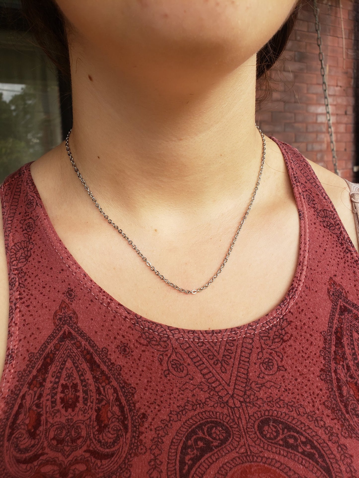 Close up of white girl wearing a 17" Stainless Steel Chain