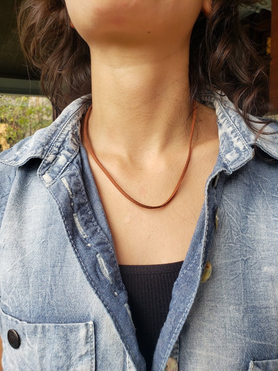 Close up of white girl with a denim shirt wearing a 17" Faux Brown Leather Cord