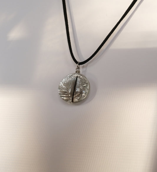 National Aviary Penguin Feather Pendant on a black cord and white background